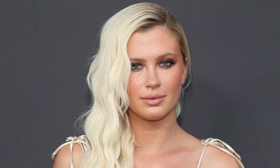 Gardening Ireland Baldwin plays gardener in plunging swimsuit